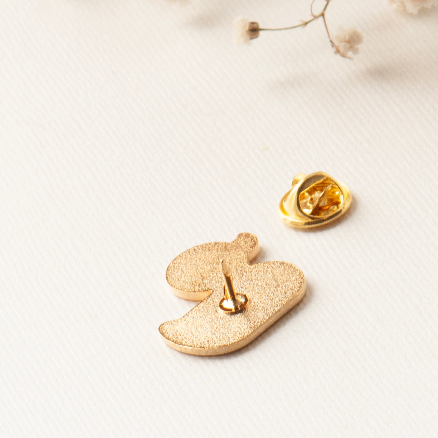 Back of the duck enamel pin, showing the pin and lock