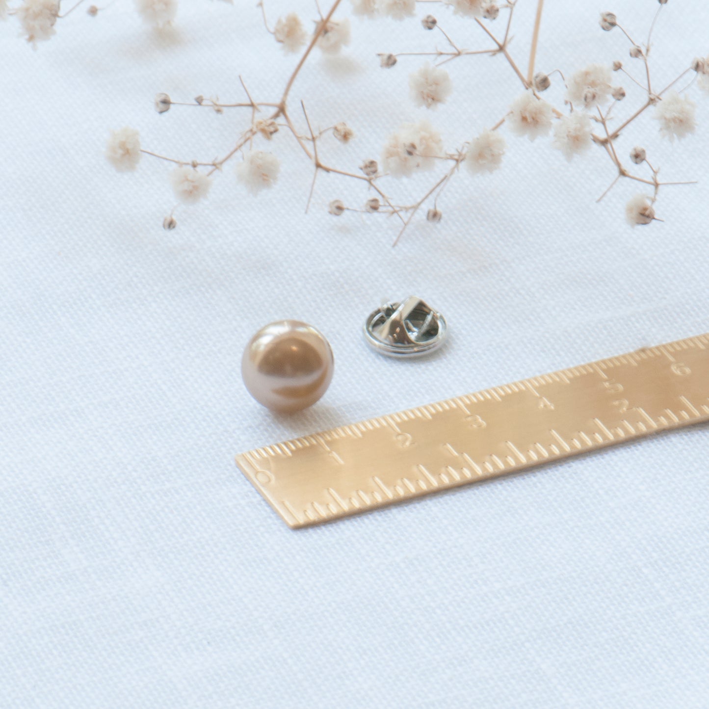 Champagne colour faux pearl modesty pin, extra button pin for a low cut blouse or wrap top. Gift for friend, gift for mum, gift for sister