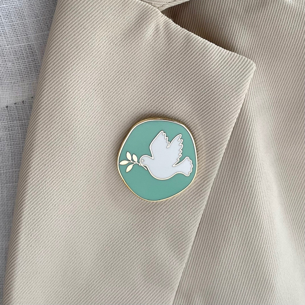 Dove of peace enamel lapel pin in mint green & gold. Gifts under £10