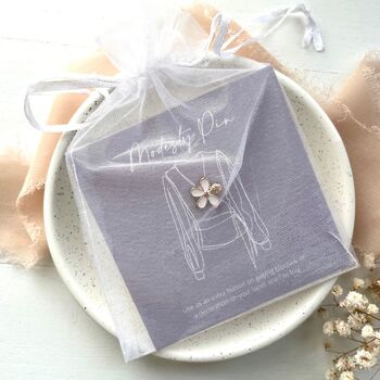 Five petal white enamel flower modesty pin on bespoke gift card in a sweet chiffon pouch ready for gifting