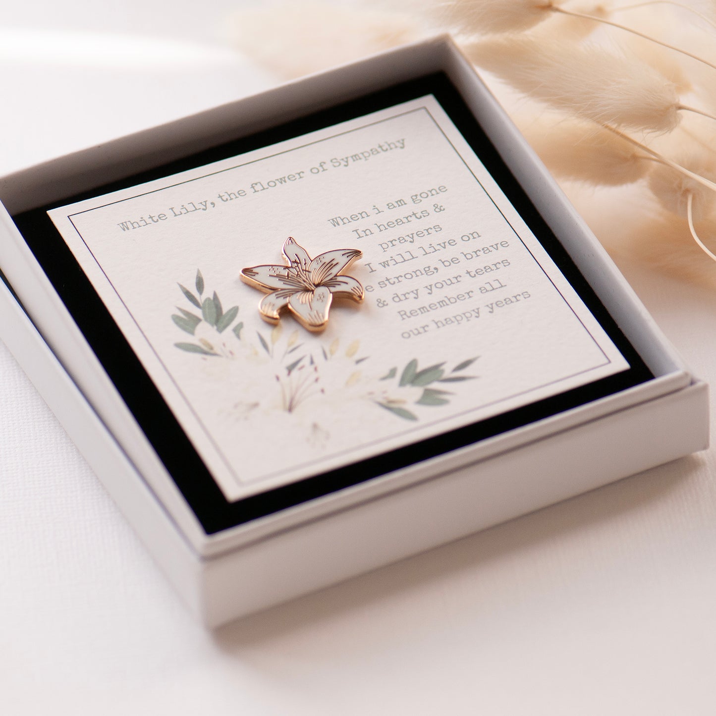 White and gold lily pin, on bespoke gift card which reads 'When i am gone, in hearts & prayers i will live on. Be strong, be brave & dry your tears. Remember all our happy years. Gift boxed ready for gifting.
Designed by Rachel - Grace & Valour