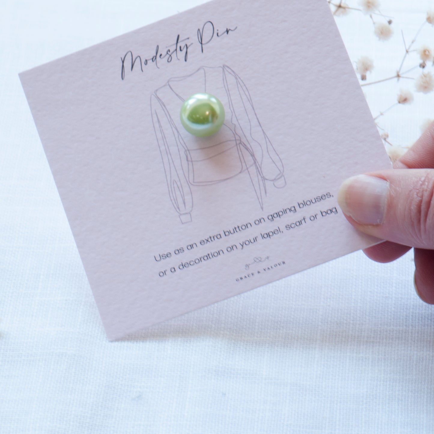Green Pearl modesty pin on bespoke Grace & Valour gift card. Green Pearl modesty pin, faux pearl pin, extra button pin for low cut top. Gifts under £10, gift for her, gift for friend,