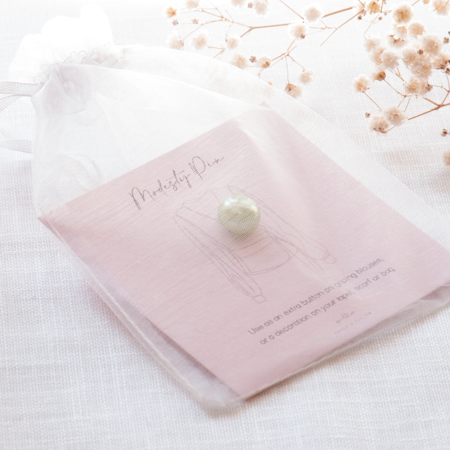Green Pearl modesty pin in chiffon pouch ready for gifting. Green Pearl modesty pin, faux pearl pin, extra button pin for low cut top. Gifts under £10, gift for her, gift for friend,