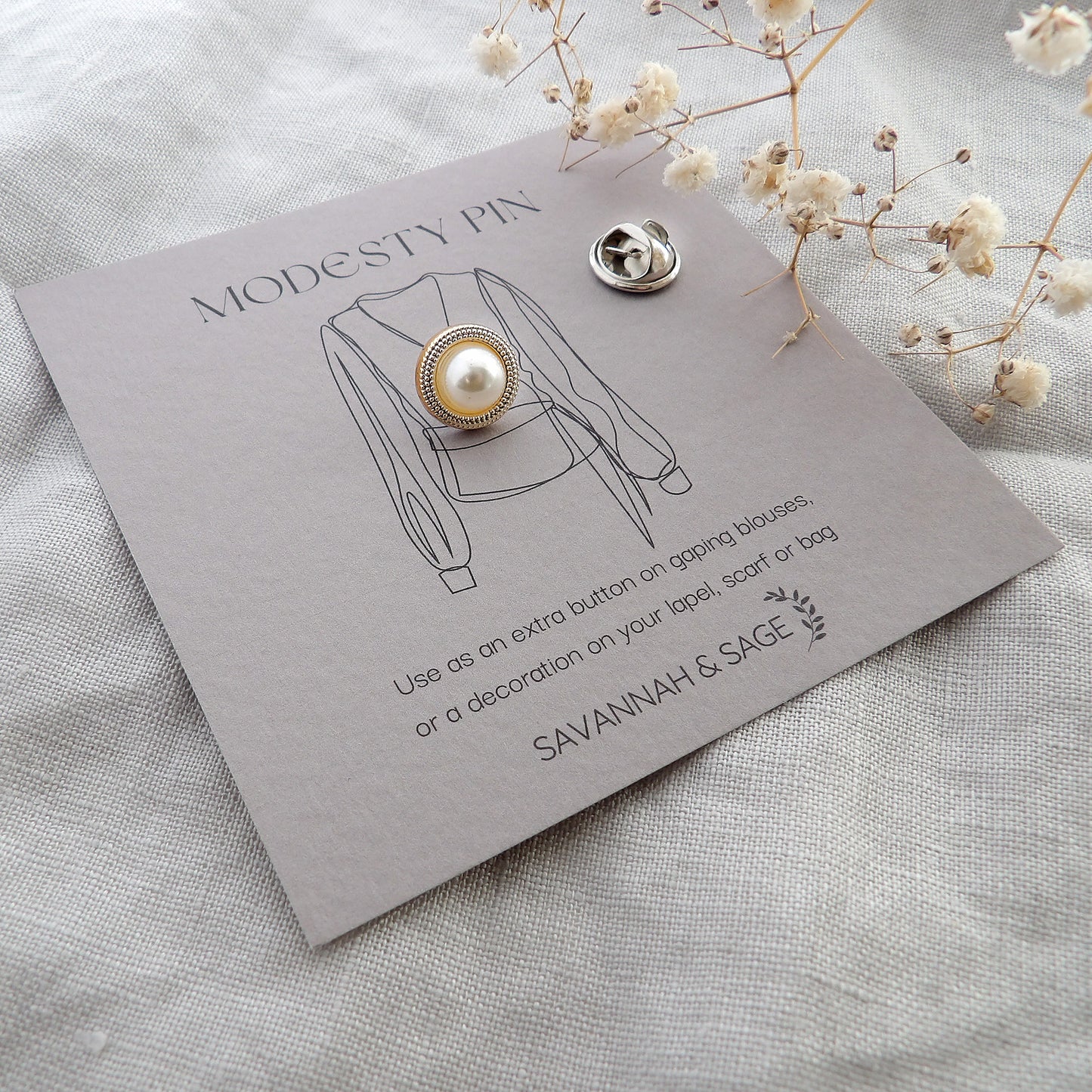 Pearl and gold modesty pin with border edge design