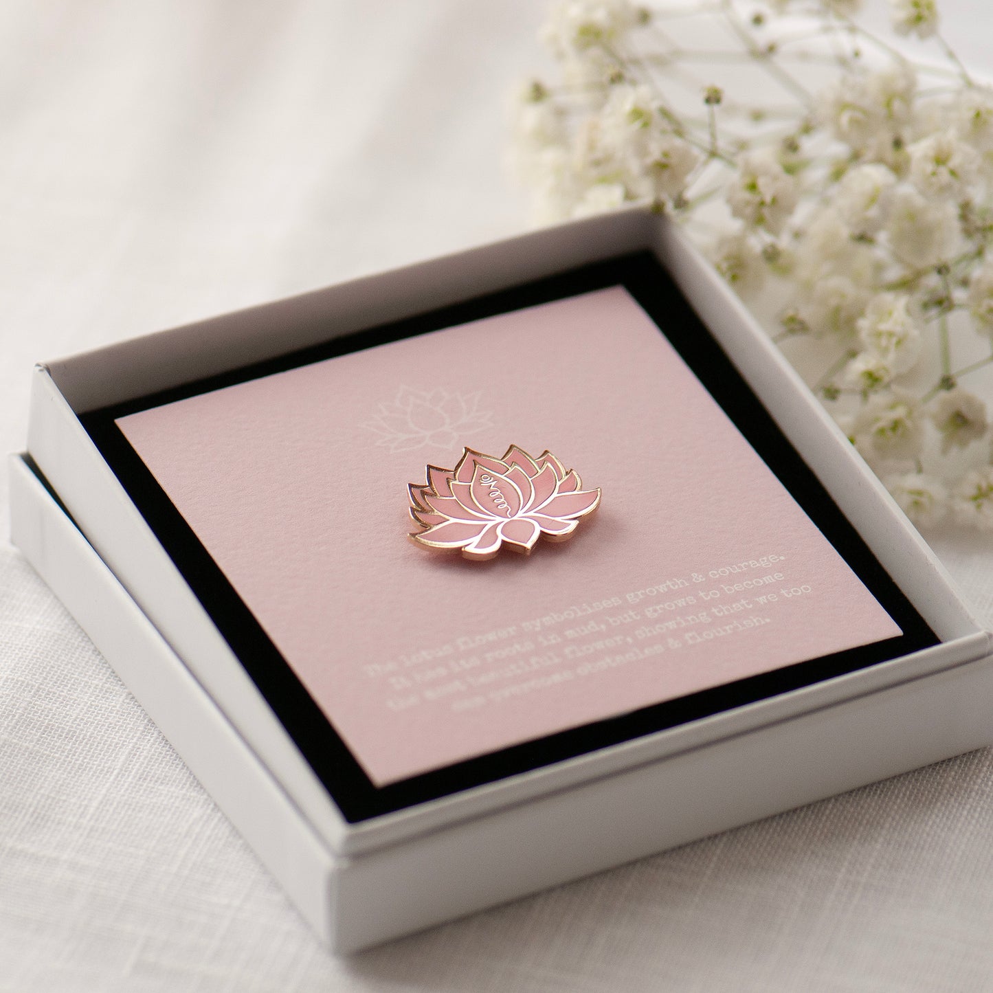 Pink lotus flower enamel pin on bespoke lotus flower gift card in gift box ready for gifting