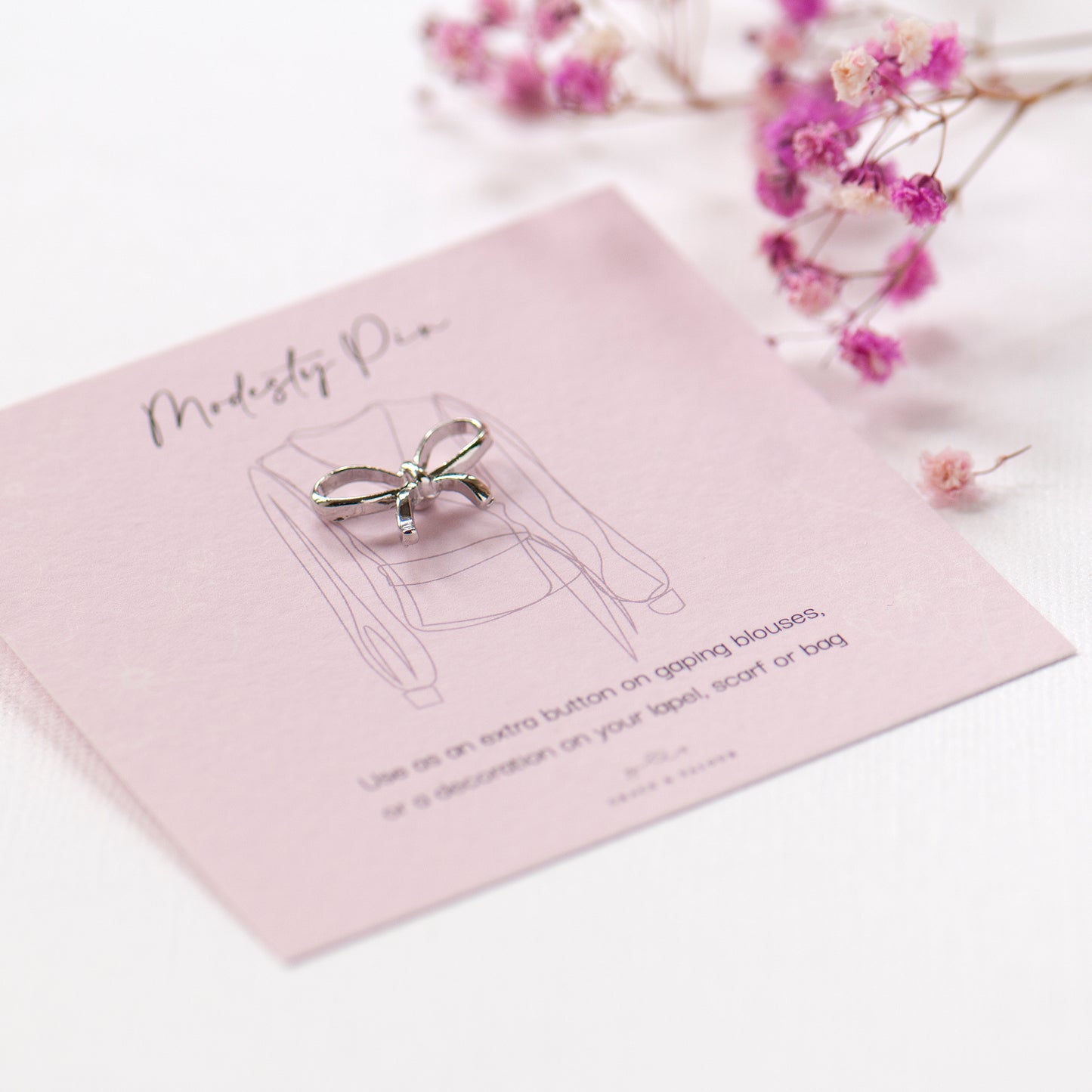 Silver bow modesty extra button pin on modesty gift card, gifts under £10