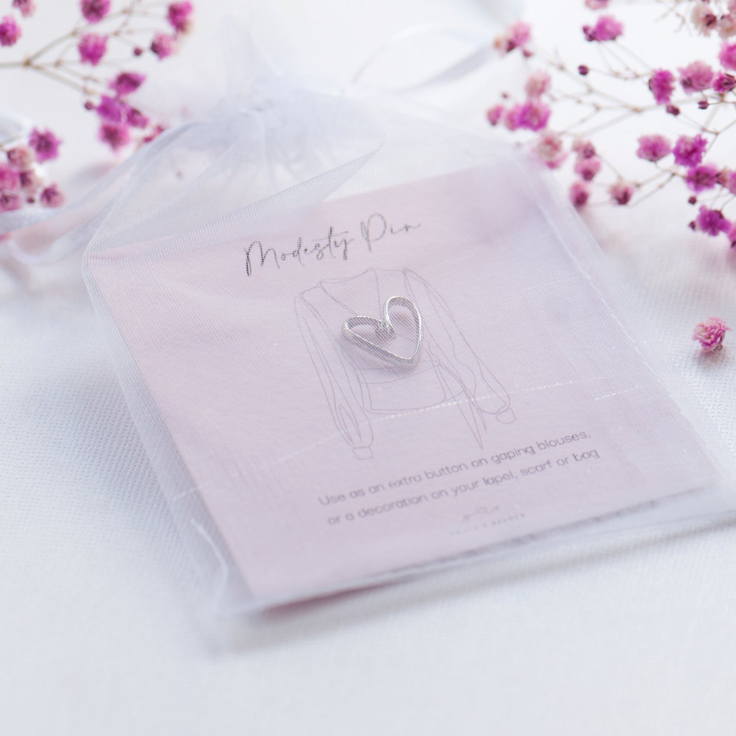 Silver heart modesty pin on bespoke modesty pin gift card in chiffon pouch, ready for gifting