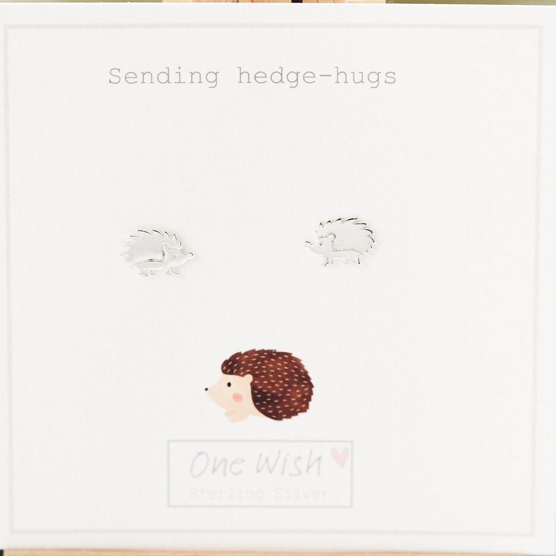 Sweet little Hedgehog Sterling Silver Stud Earrings on Bespoke gift card which says 'Sending hedge-hugs'