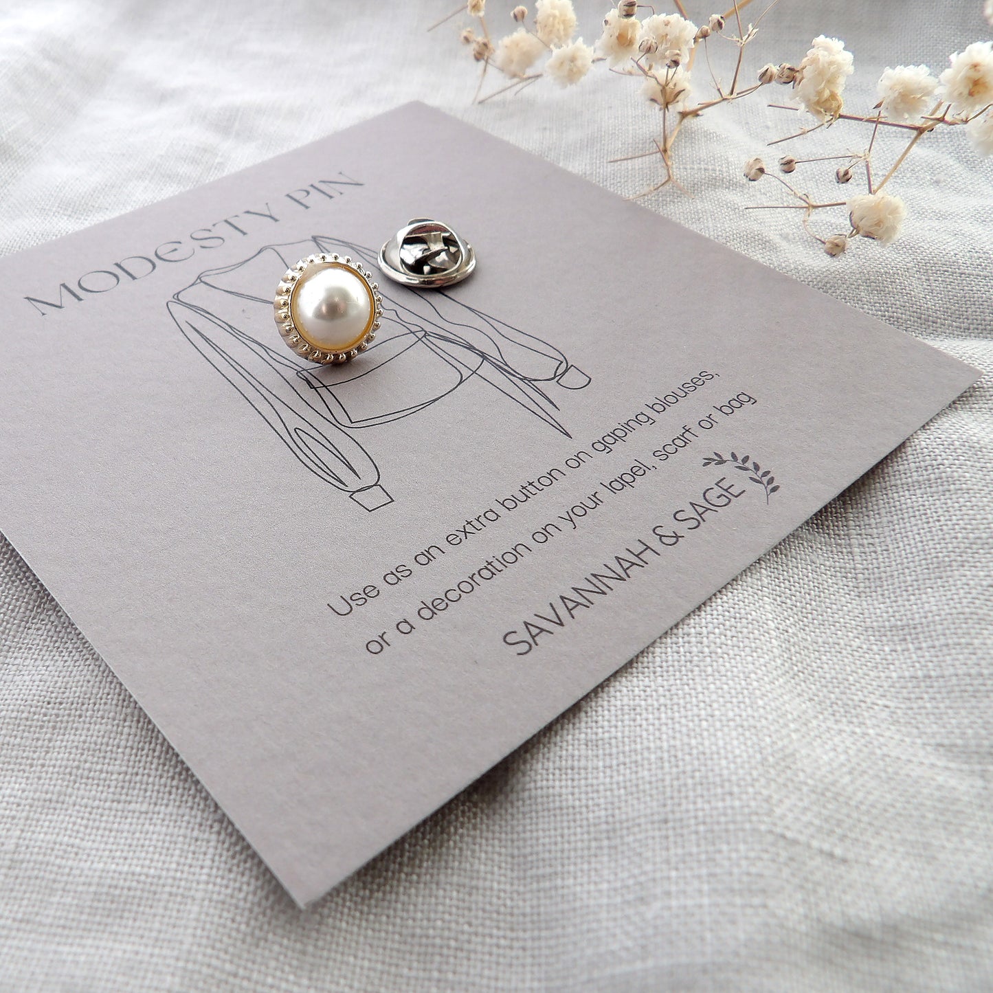 white pearl modesty pin on bespoke gift card