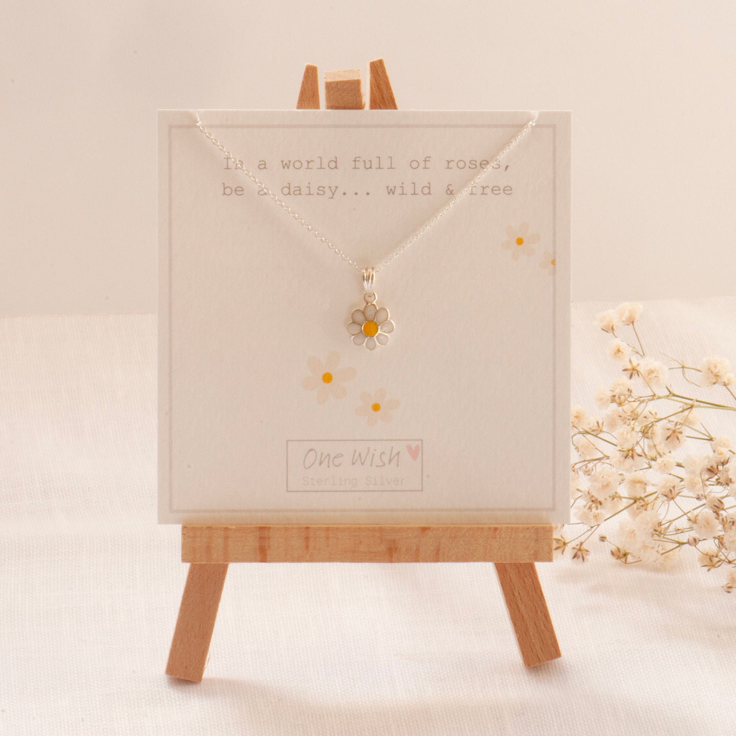 White daisy sterling silver necklace on bespoke gift card which says 'In a world of roses, be a daisy, wild and free' Great gift for her, gift for confidence, remember who you are, flower pendant and white daisy necklace