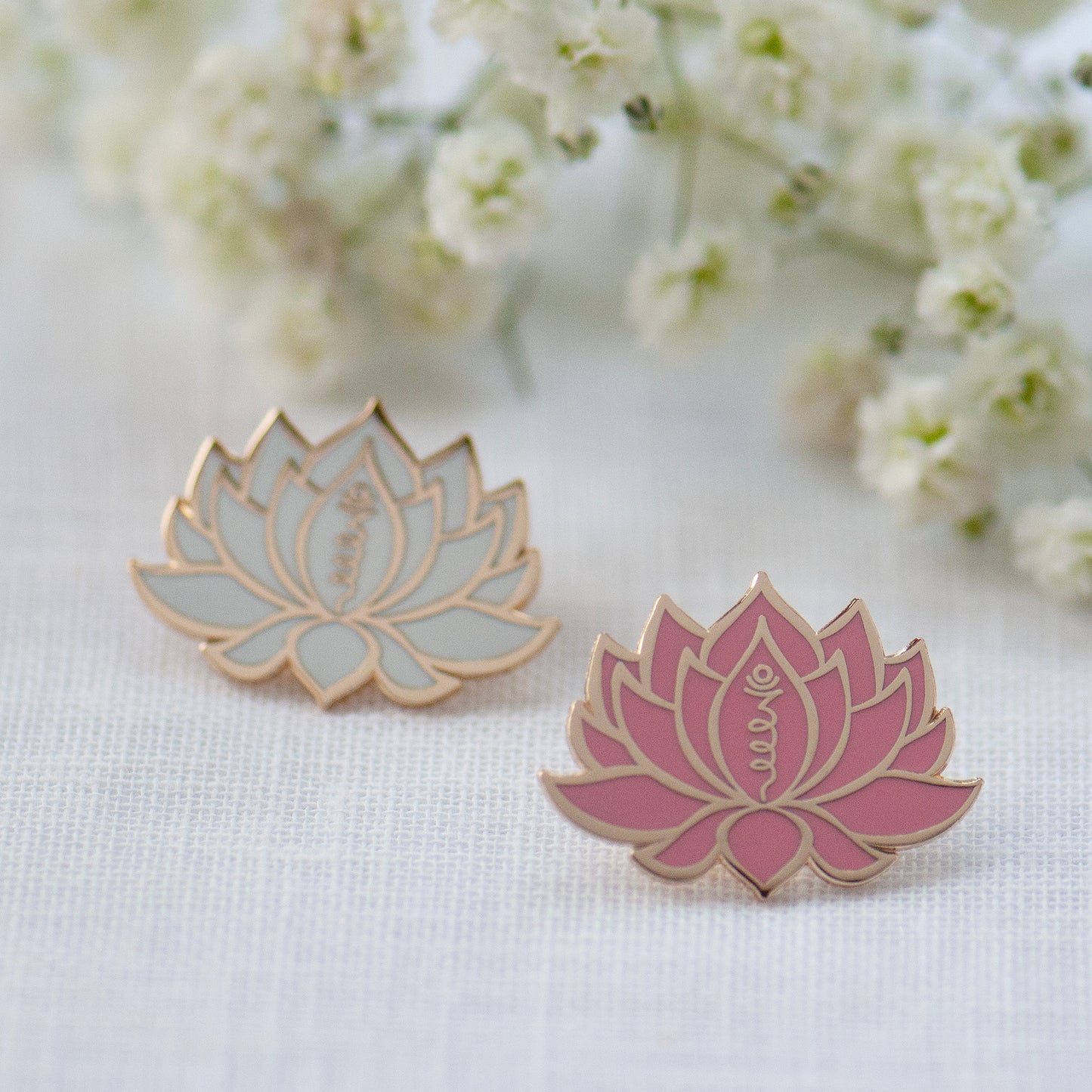 White or pink and gold lotus flower with unalome symbol, made from enamel, designed by Rachel - Grace & Valour