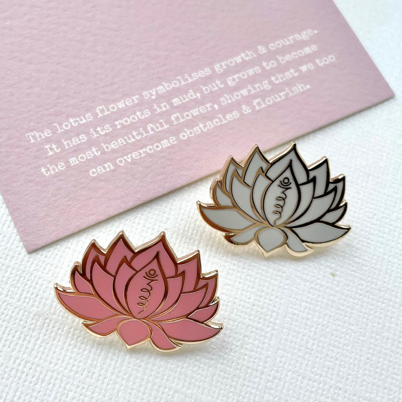 White or pink and gold lotus flower with unalome symbol, made from enamel, on lotus flower gift card, designed by Rachel - Grace & Valour
