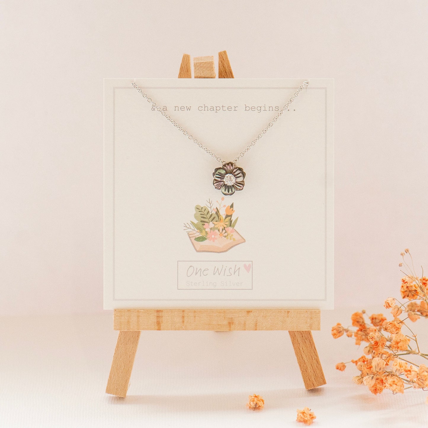 & a new chapter begins quote giftcard and flower necklace made from abalone shell