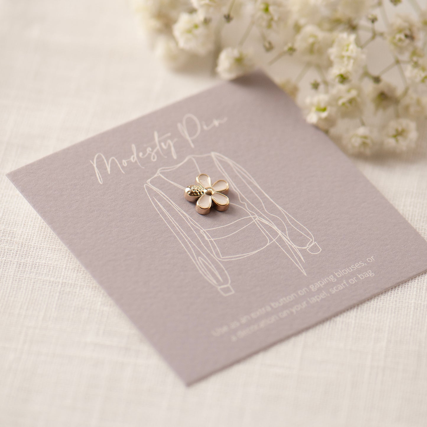 modesty pin gift card with white five petal flower pin, cleavage pin, gifts under £10