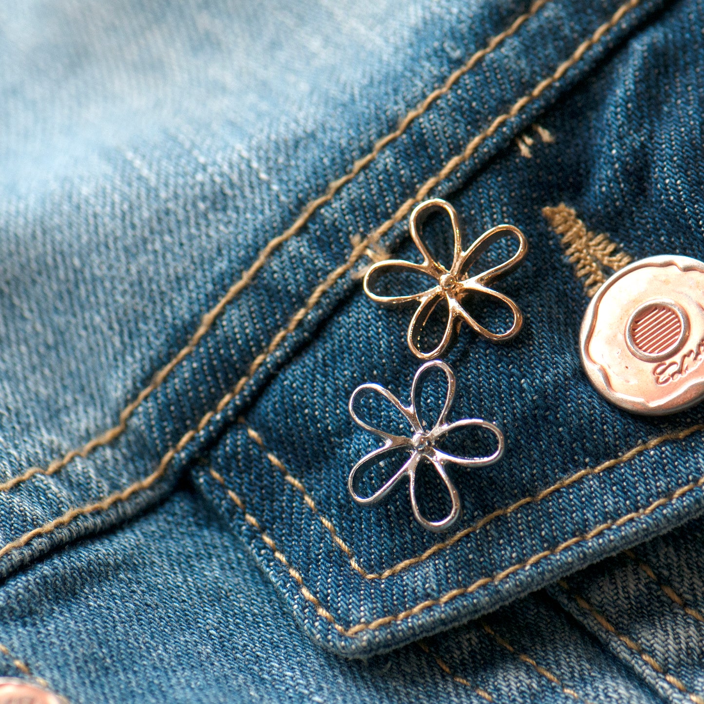 gold and silver modesty pin used as a pocket decoration.