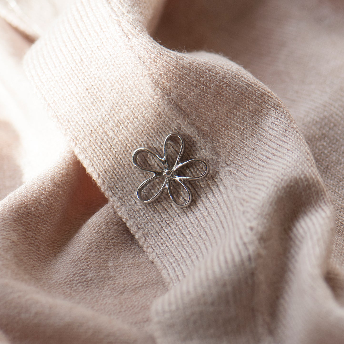 silver modesty pin used as a lapel pin brighten up a lapel