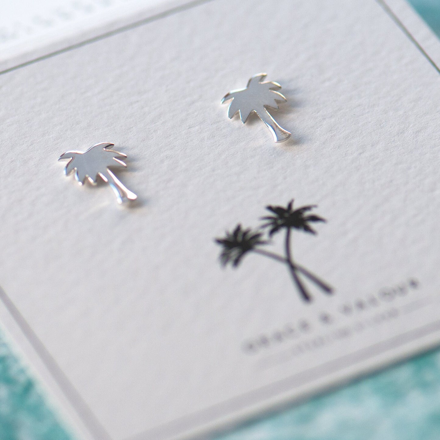 Palm tree stud earrings sterling silver 925 on bespoke palm tree gift card, perfect for summer, beach holidays or to remind you of summer fun. gift for her, gift for traveller, gift for bestie