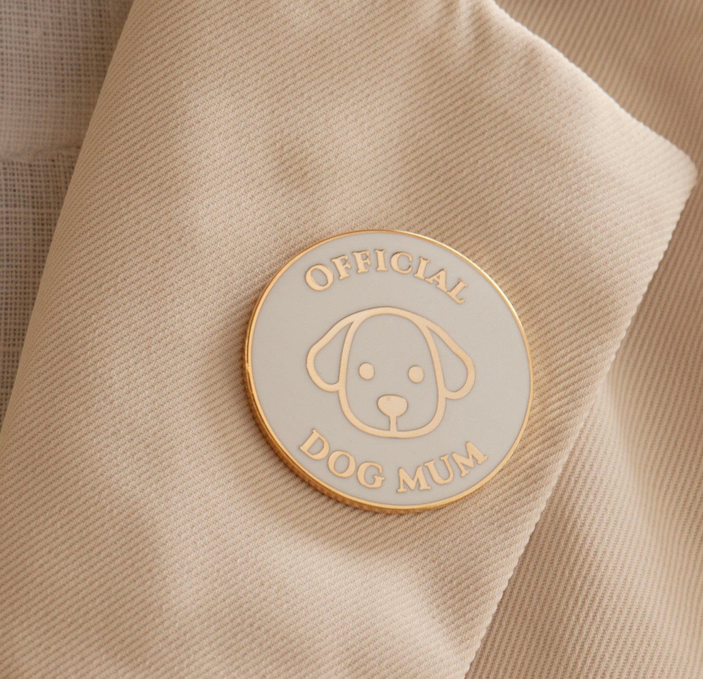 white and gold official dog mum lapel pin