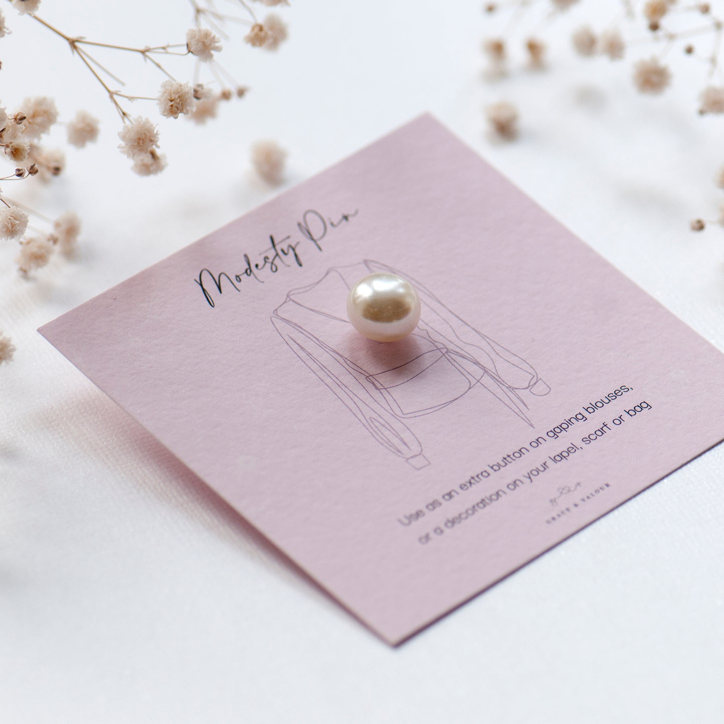 white pearl modesty pin on gift card ready for gifting
