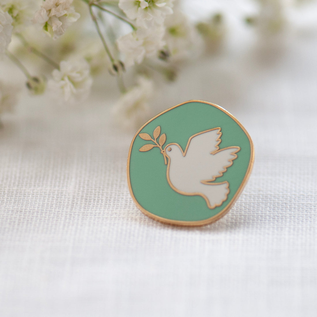 Mint green and white dove of peace enamel pin 
