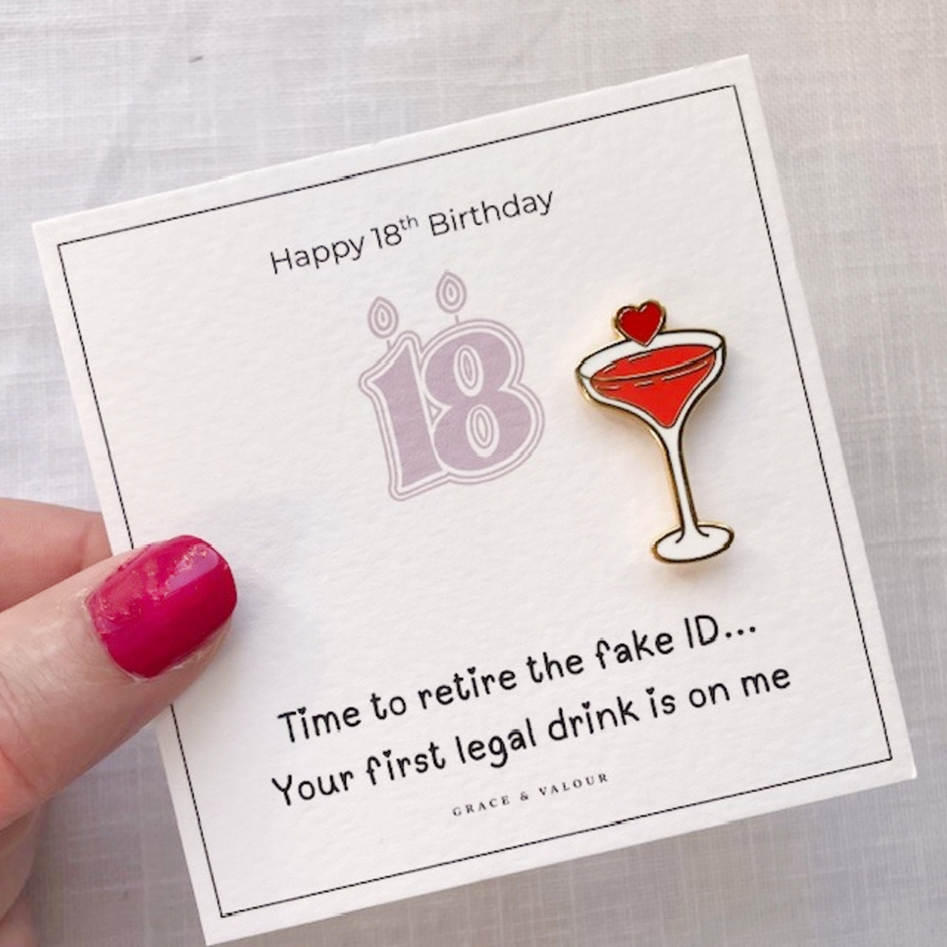 18th birthday card with a cocktail glass and candle pin on a white background