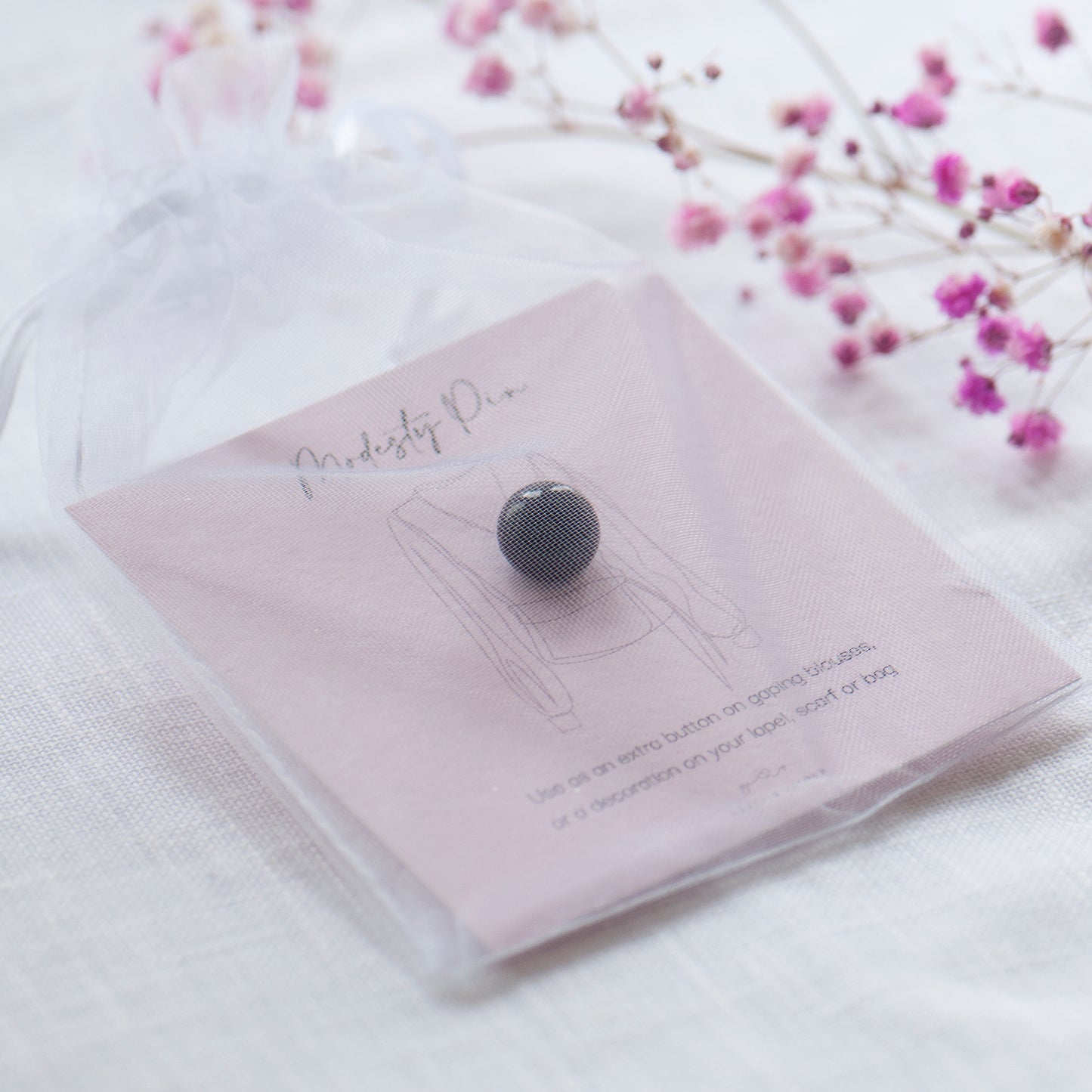 Black pearl modesty pin on modesty pin gift card in chiffon pouch, ready for gifting