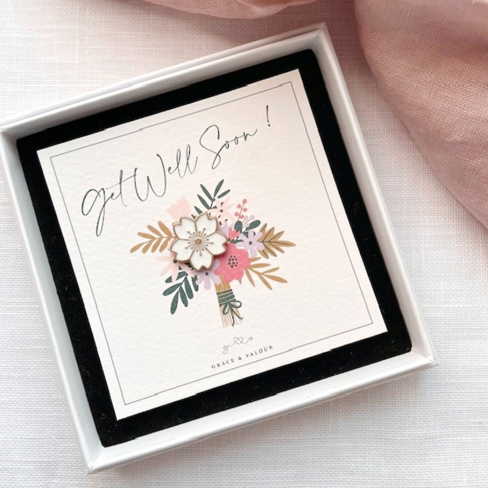 Get well soon card with floral design in a white box ready to gift