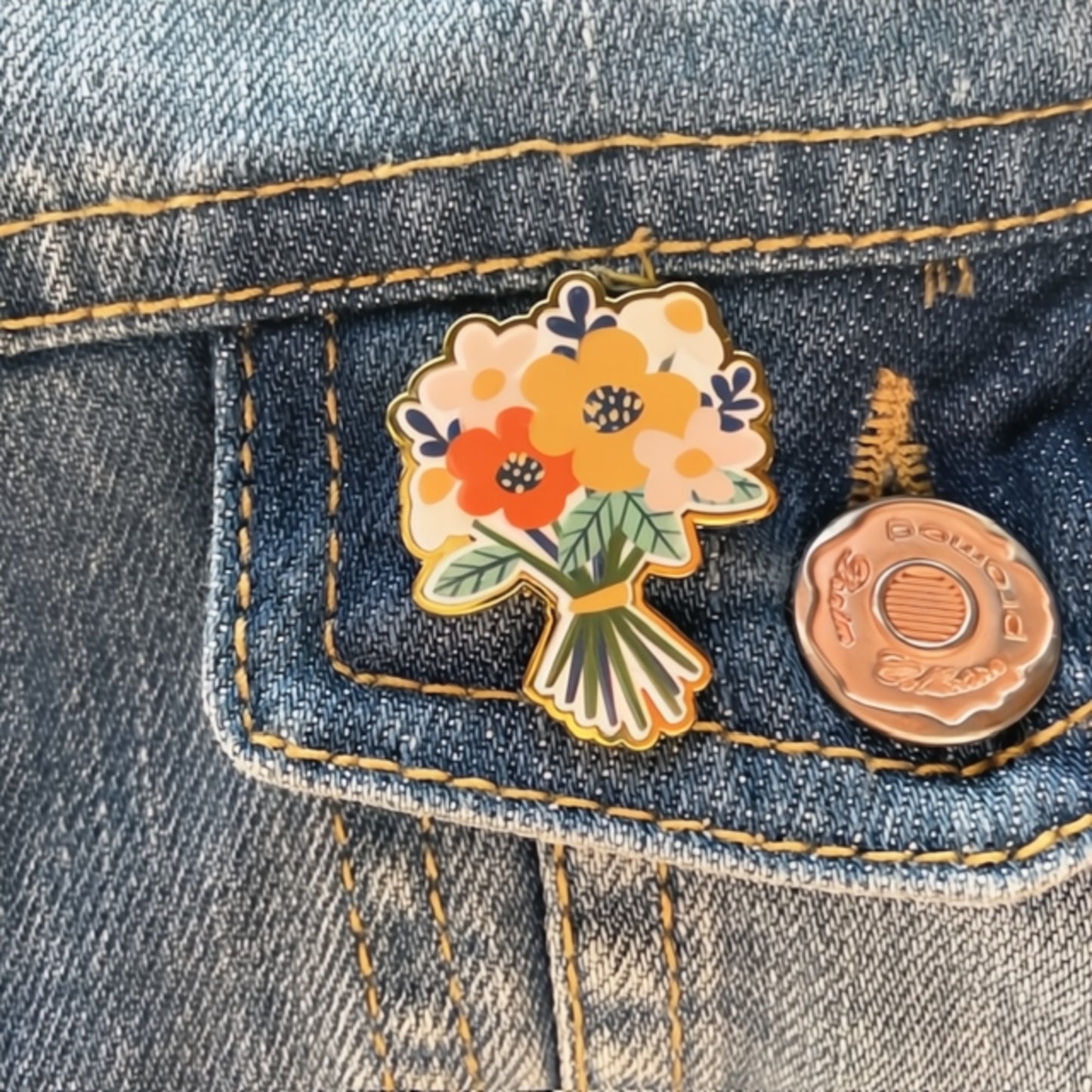 Floral pin on a denim jacket pocket