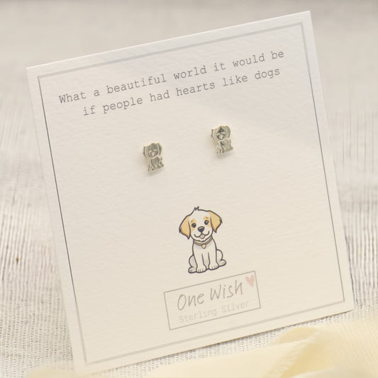 Sterling silver dog stud earrings displayed on a white card with a printed quote, a puppy illustration, and the brand name 'One Wish'.