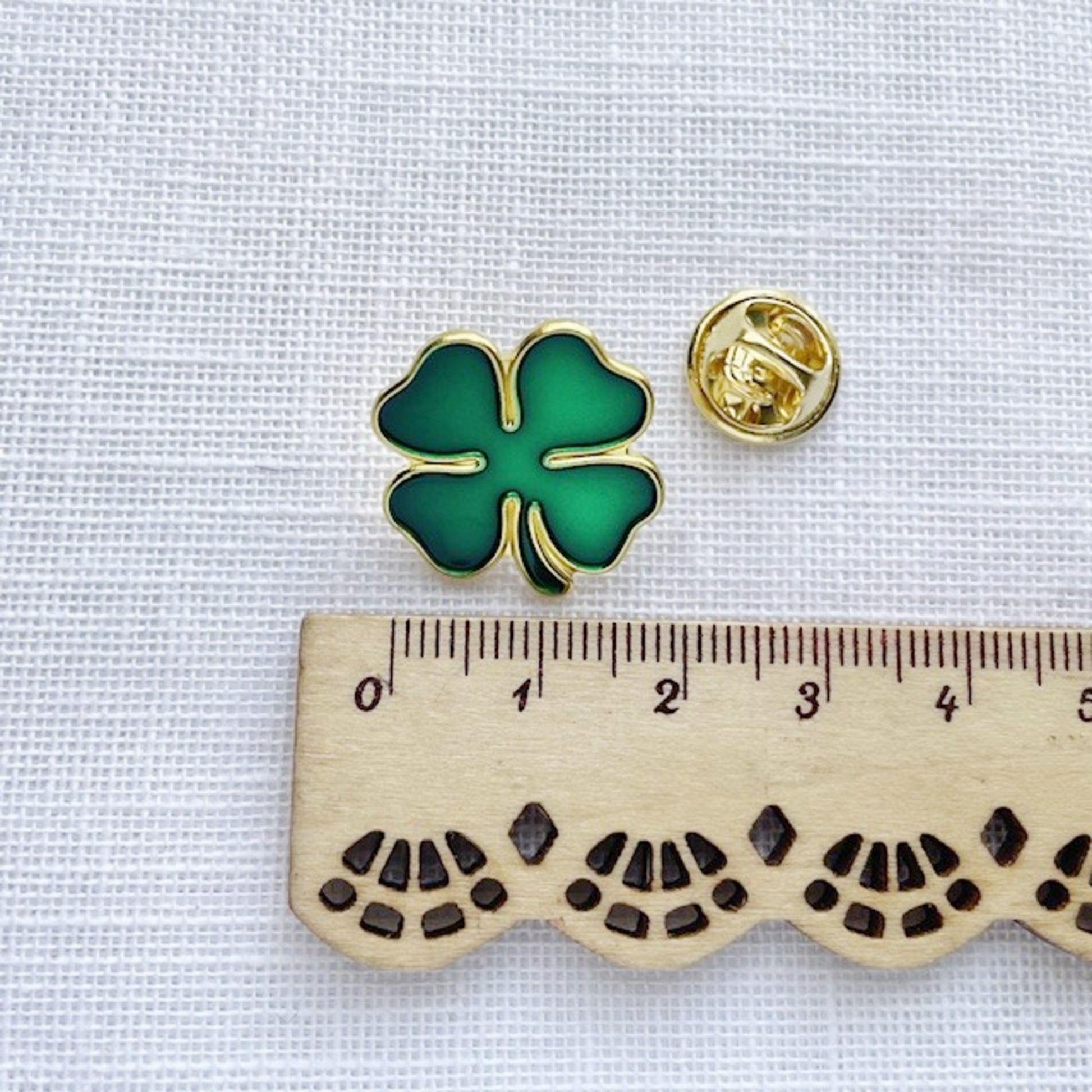 Green and gold clover enamel pin measurements