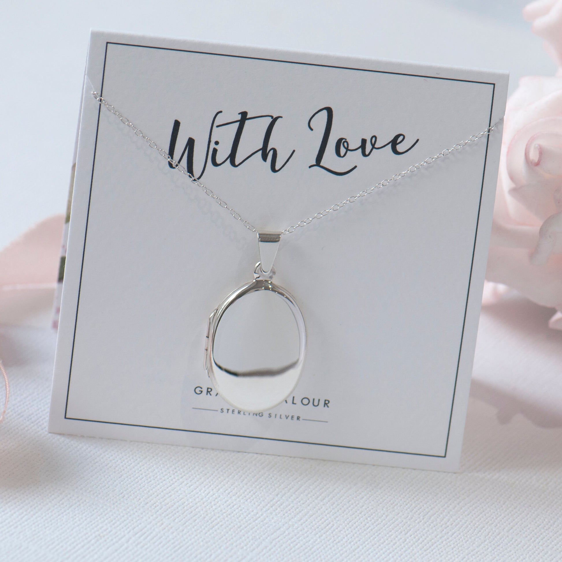 Sterling silver locket oval shape, slimline, modern style on a 'with love' giftcard