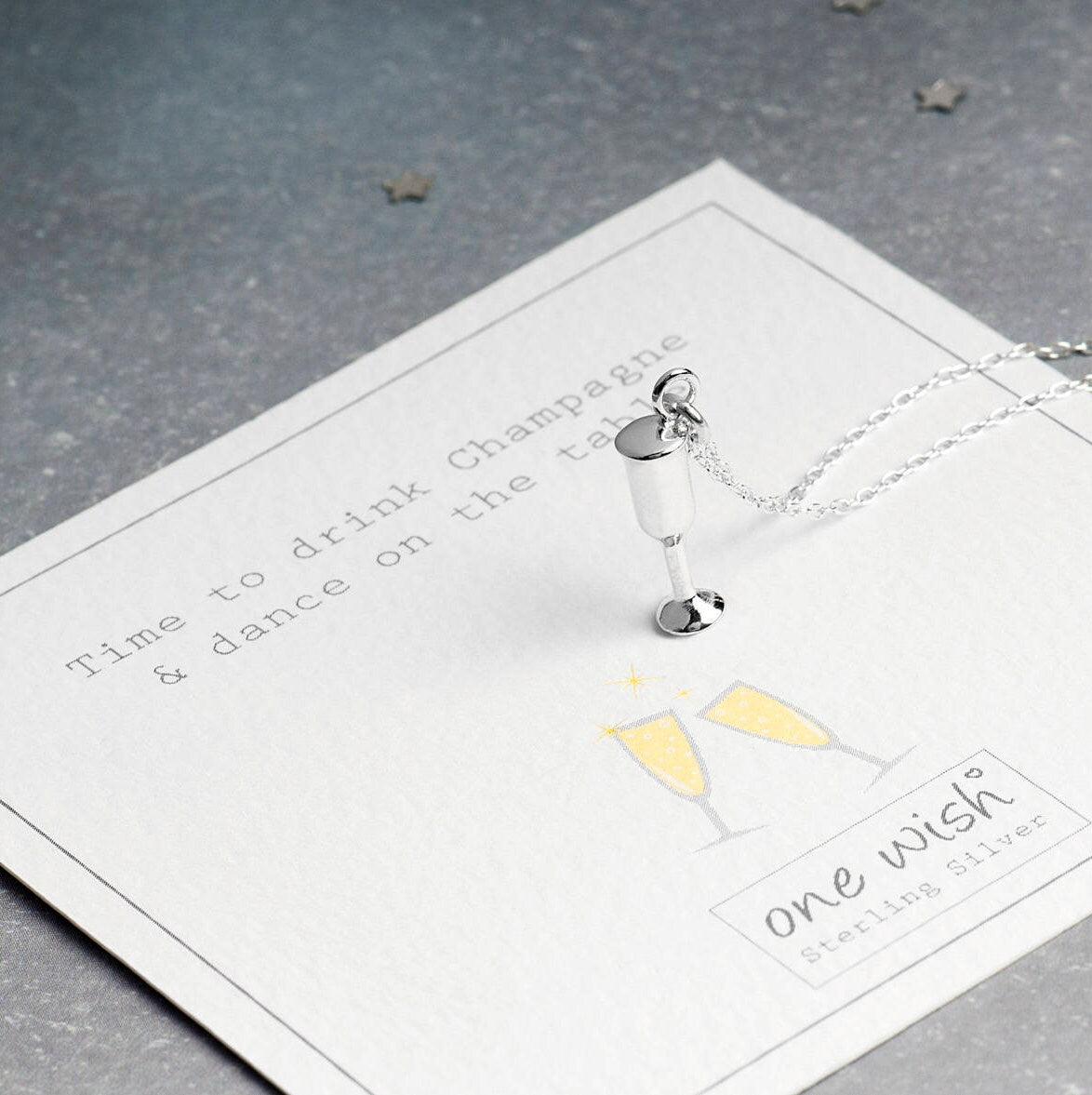 sterling silver champagne pendant on a gift card that says 'time to drink champagne and dance on the table'