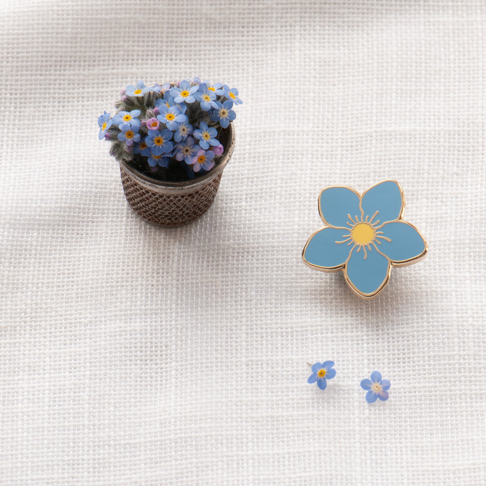Sweet little forget me not enamel pin in cornflower blue and sunshine yellow, sympathy gift, gifts under £10.