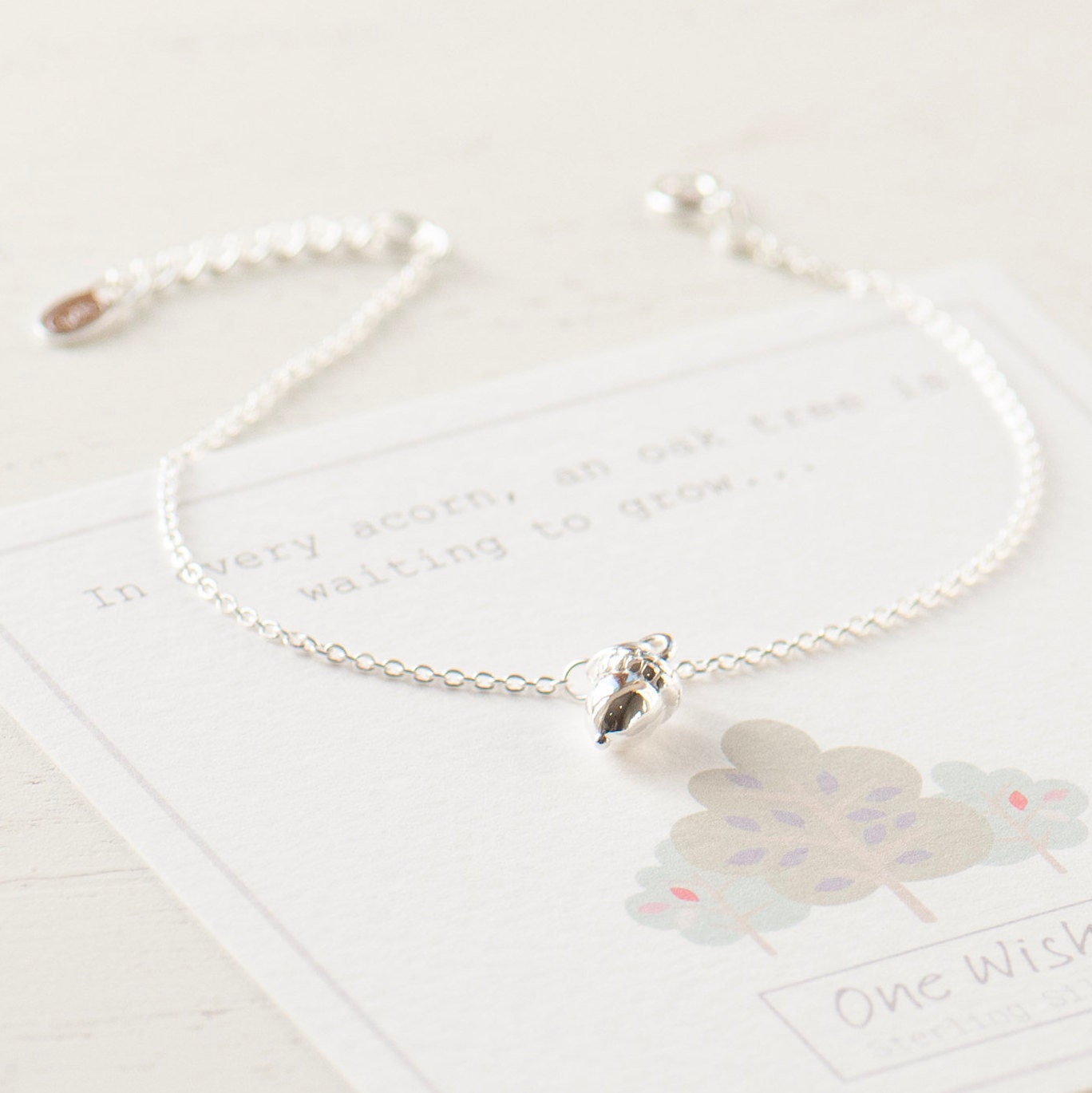 sweet little sterling silver acorn bracelet on gift card that says - In every acorn an oak tree is waiting to grow.