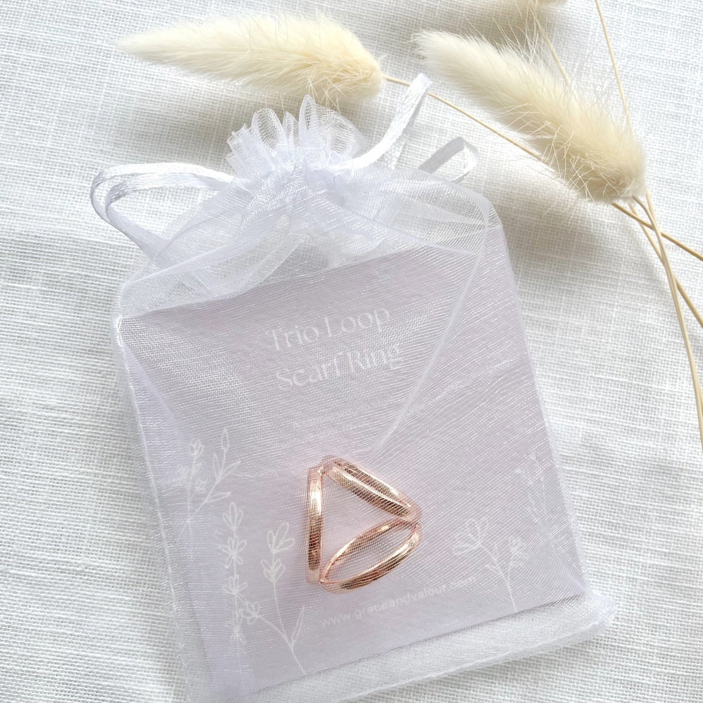 Rose gold scarf ring on a branded giftcard in a chiffon pouch ready for gifting