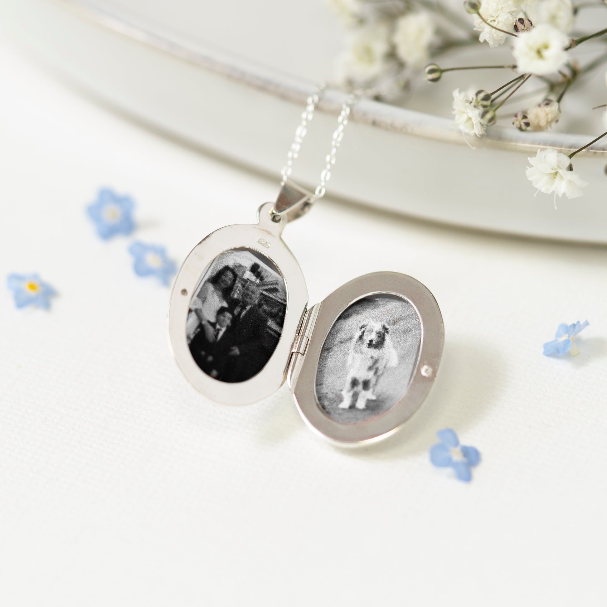 Birthflower sterling silver locket engraved with your birthflower add your pictures to your locket. This locket holds two portrait style pictures