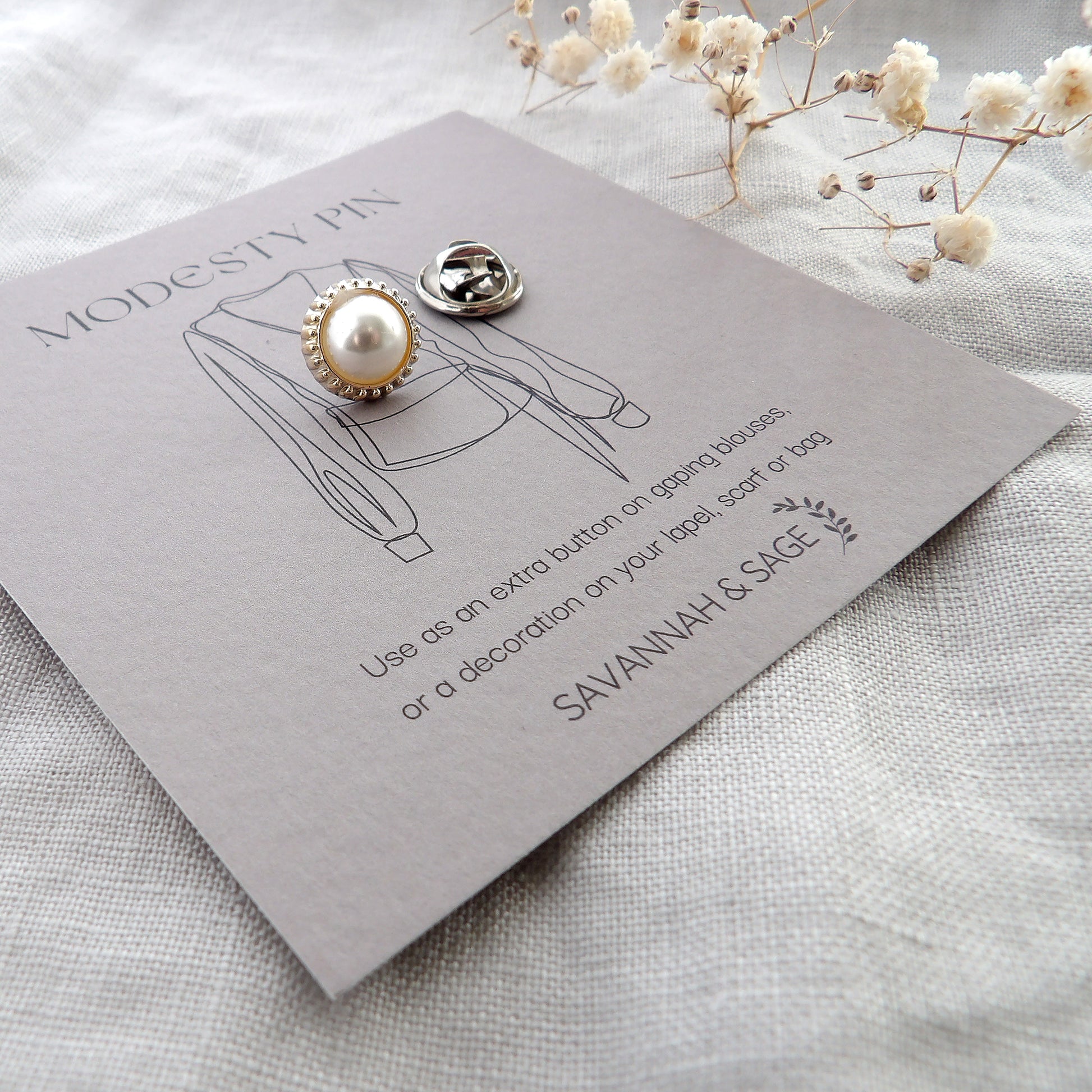 white pearl modesty pin on bespoke gift card