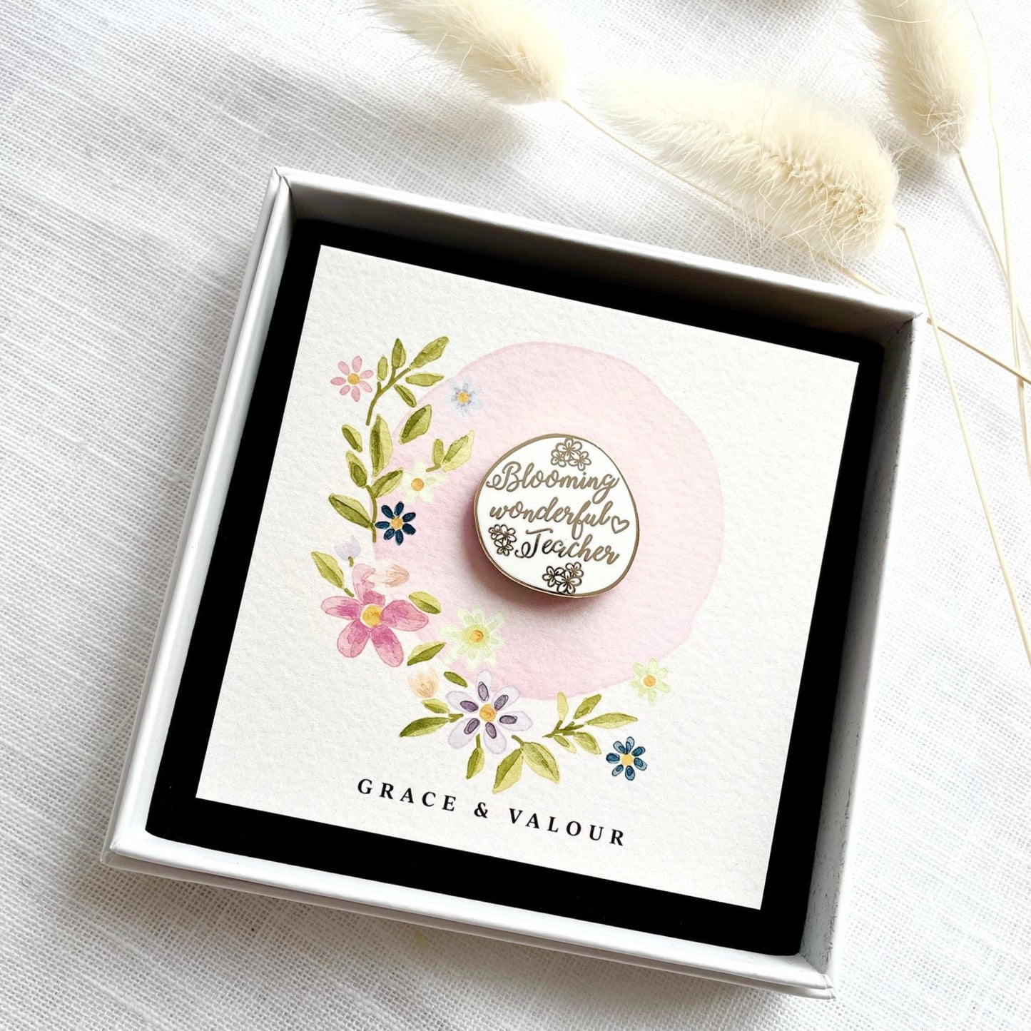Decorative card with floral design and 'Blooming Wonderful Teacher' enamel pin badge in a gift box.