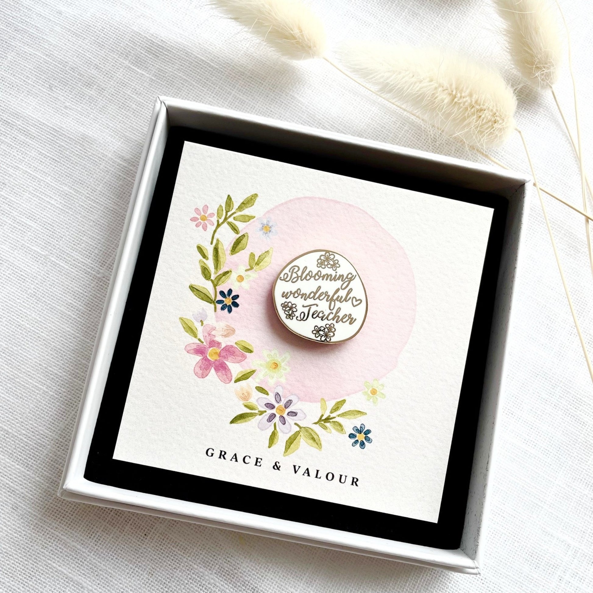 Decorative card with floral design and 'Blooming Wonderful Teacher' enamel pin badge in a gift box.