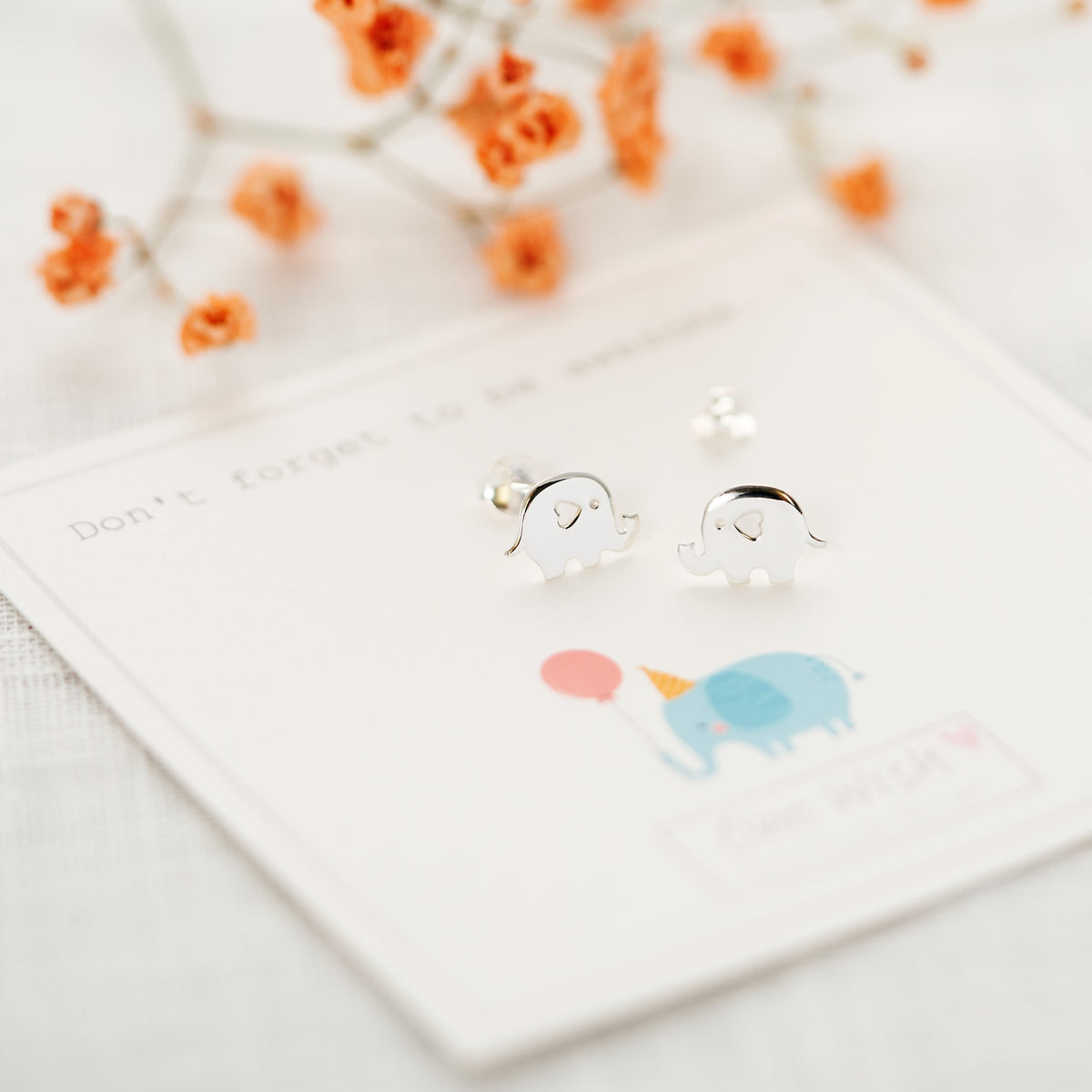 good luck gift elephant earrings on gift card that says 'Don't forget to be awesome'