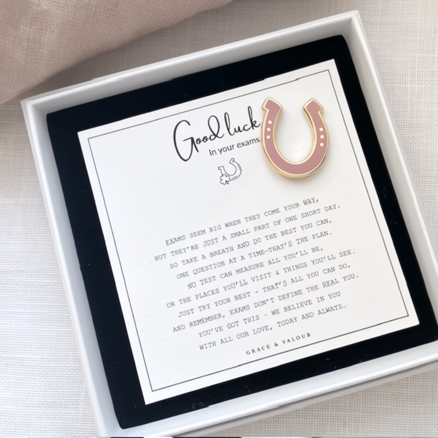 Pink horseshoe enamel pin with a Good Luck in your exams poem card in a box