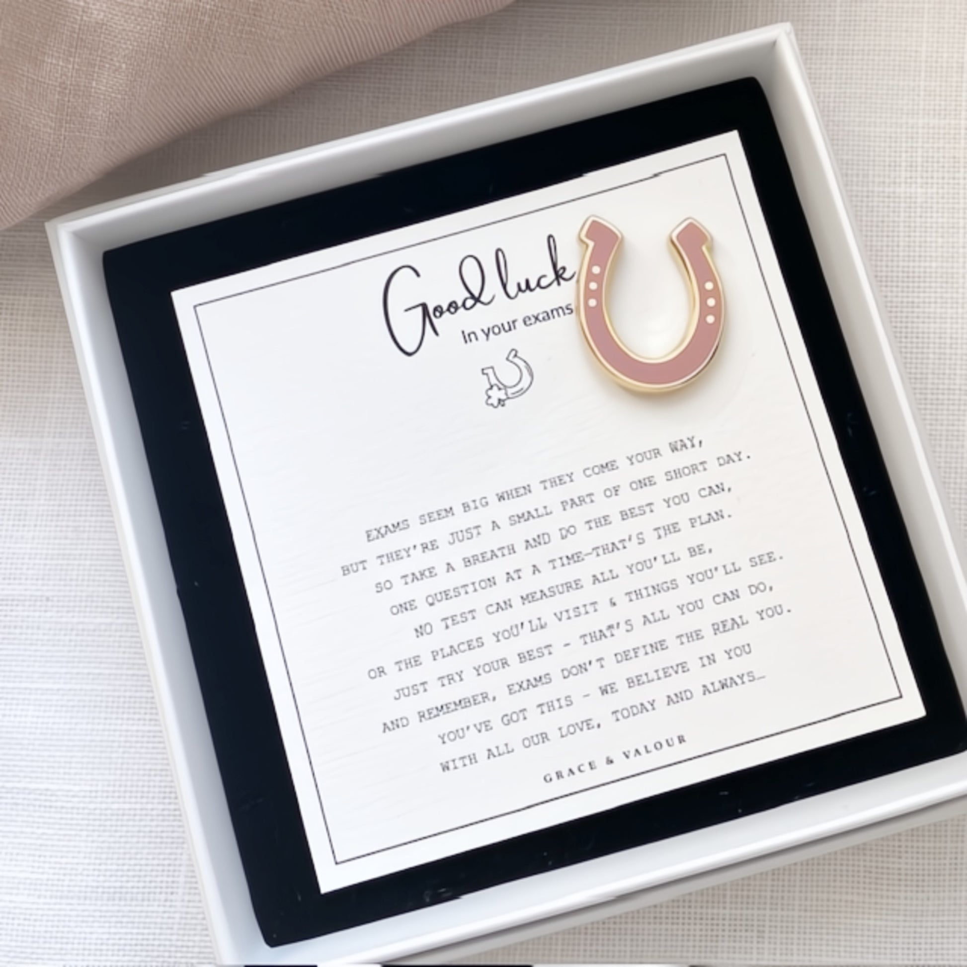 Pink horseshoe enamel pin with a Good Luck in your exams poem card in a box