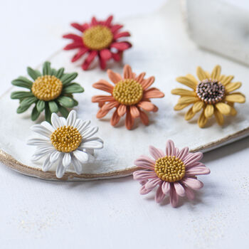 Daisy brooches, pink, orange, green red, yellow and white colours