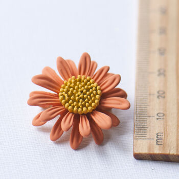 Orange daisy brooch