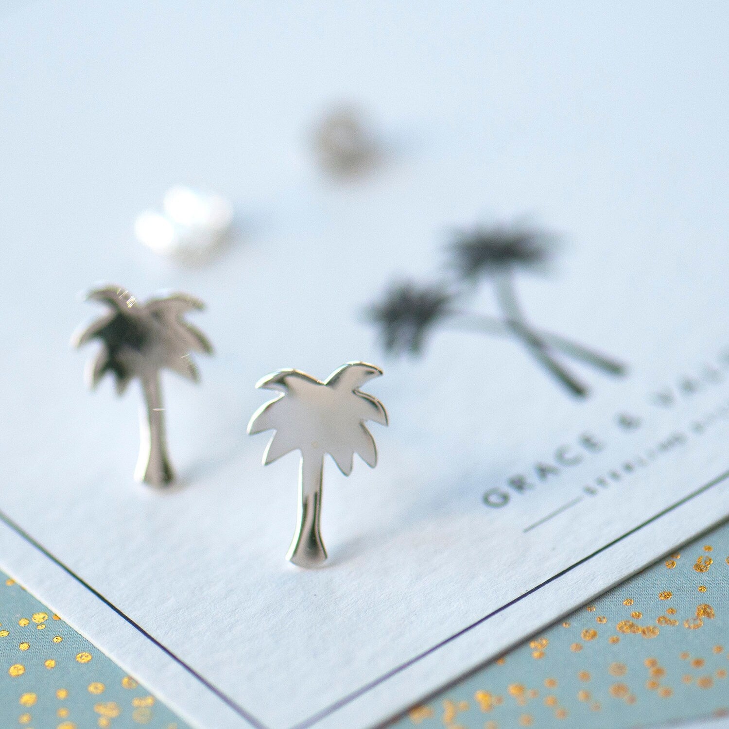 Palm tree stud earrings sterling silver 925 on bespoke palm tree gift card, perfect for summer, beach holidays or to remind you of summer fun. gift for her, gift for traveller, gift for bestie