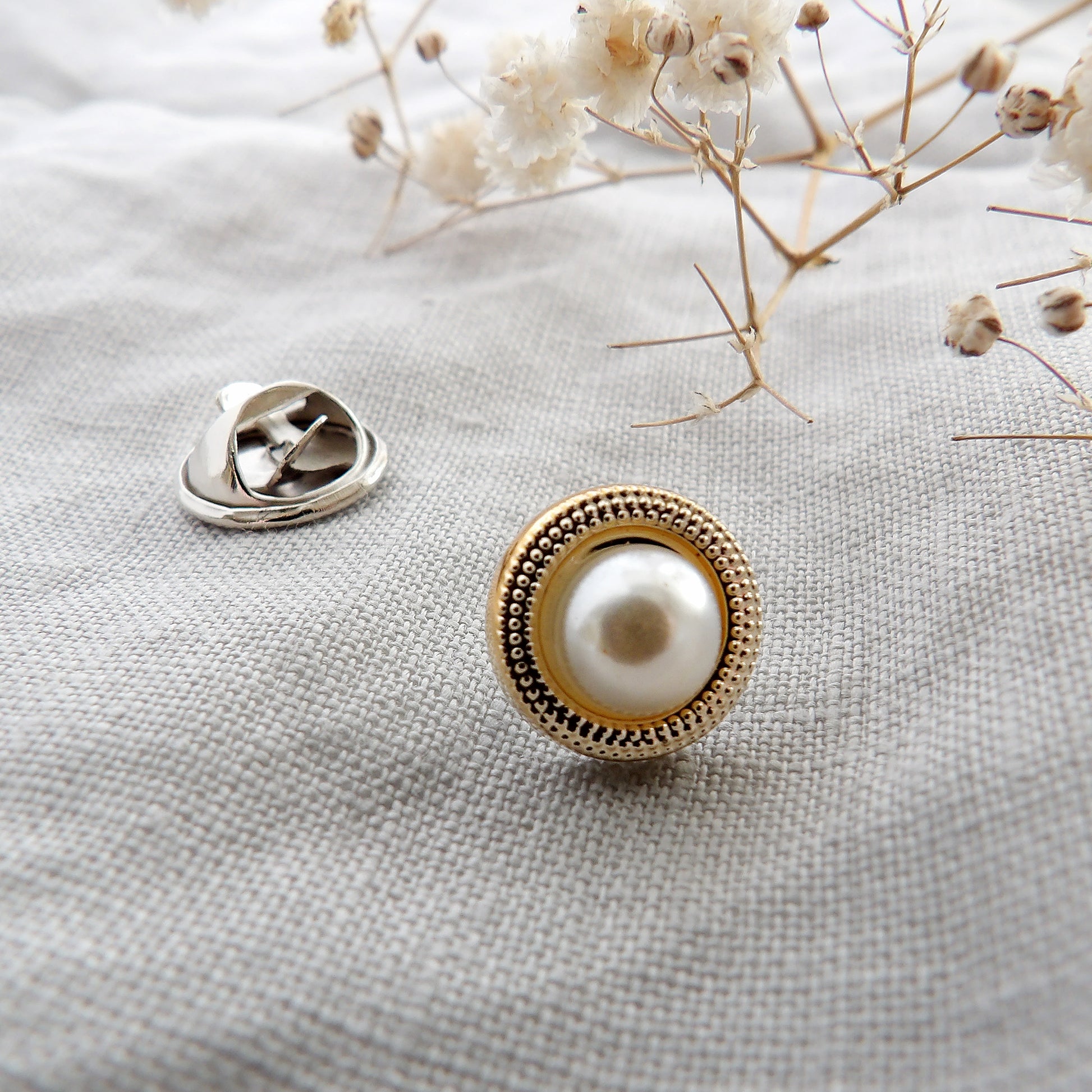 pearl and gold surround modesty pin close up deatil picture, extra button pin