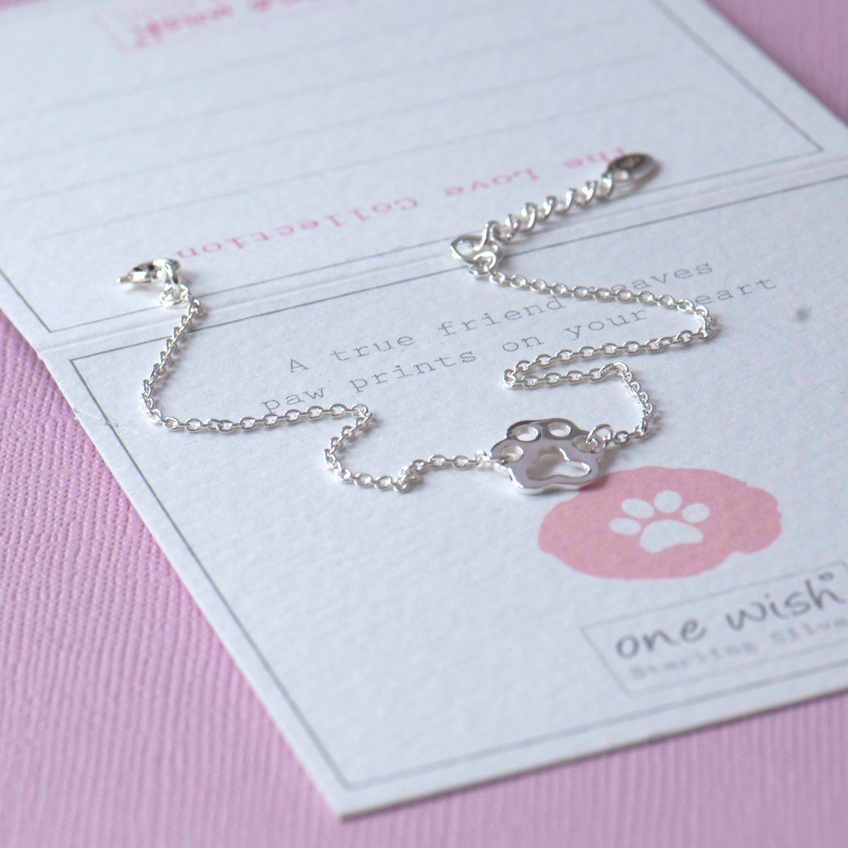 paw print silver bracelet on a gift card with an animal lover quote