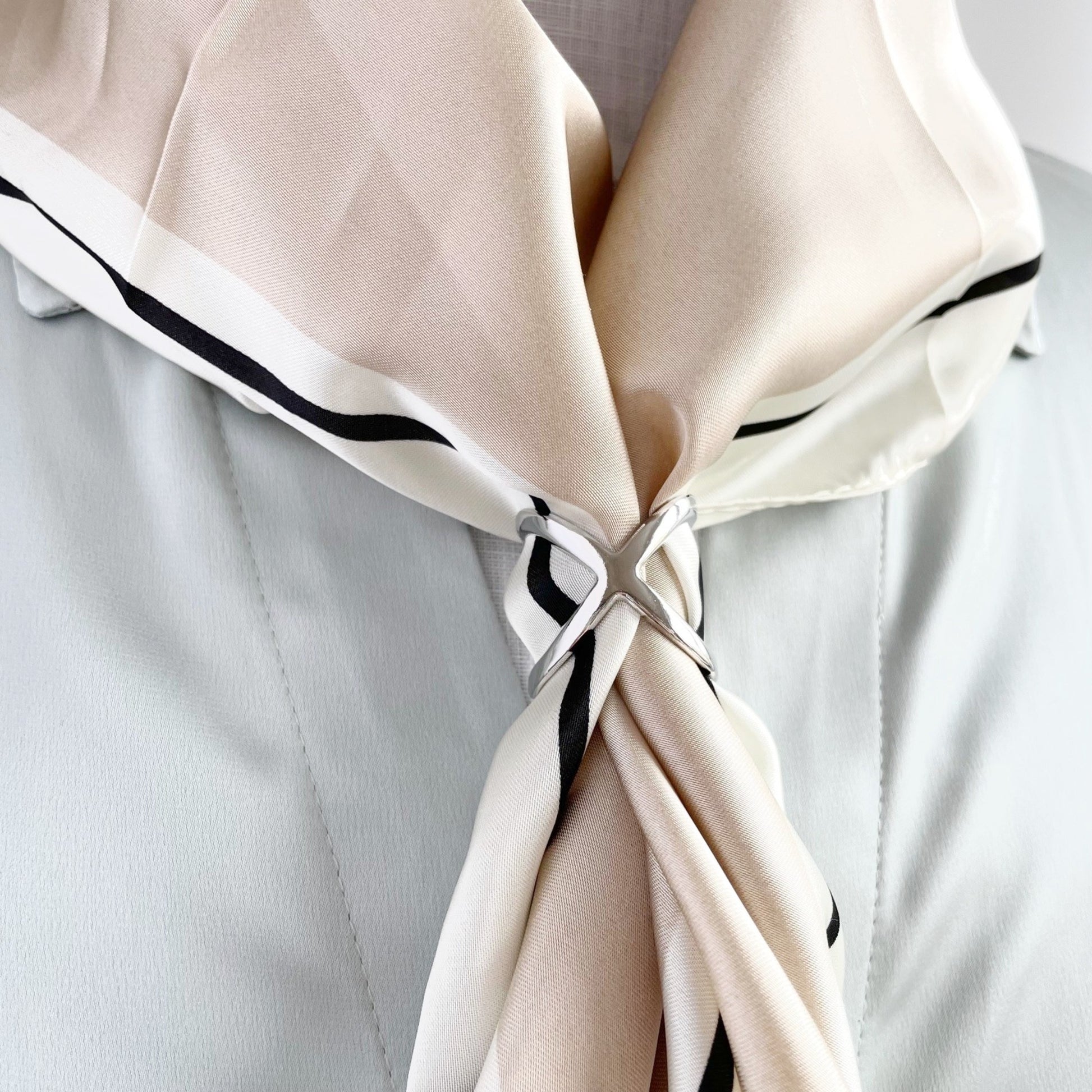 silver scarf ring holder on model wearing silk scarf