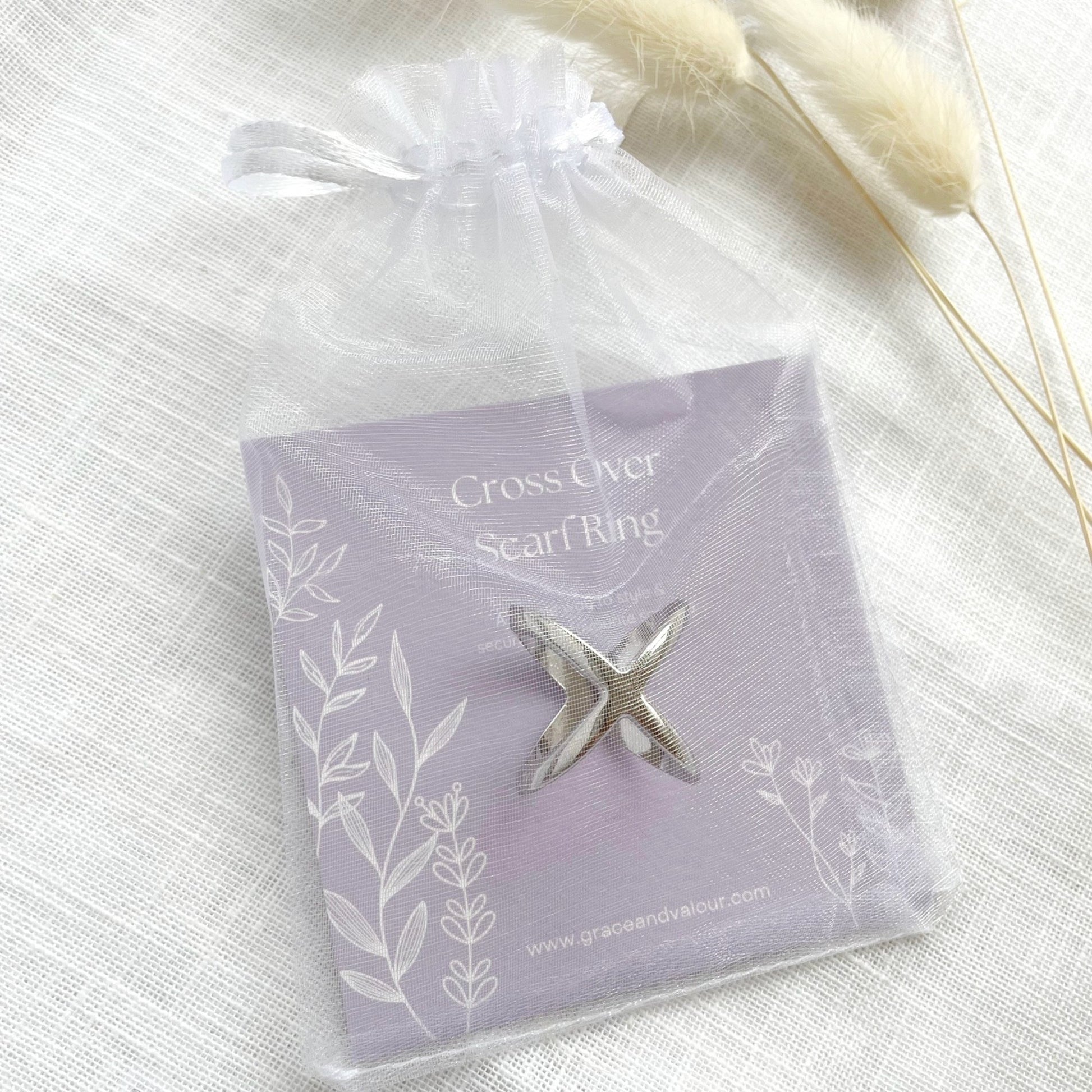 Silver scarf ring in a chiffon pouch packaging