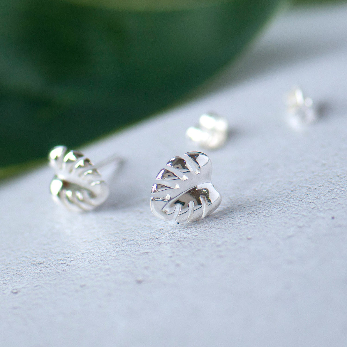polished monstera leaf stud earrings grace and valour